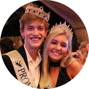 teen boy and girl wearing crowns